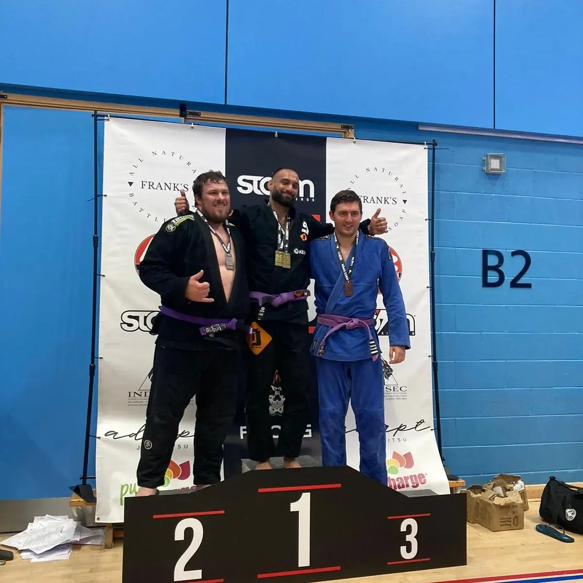 Competition podium with gold and bronze medallists